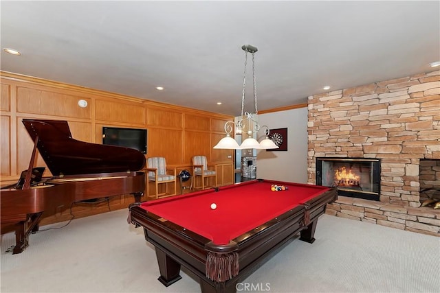 playroom featuring crown molding, pool table, a fireplace, and light carpet