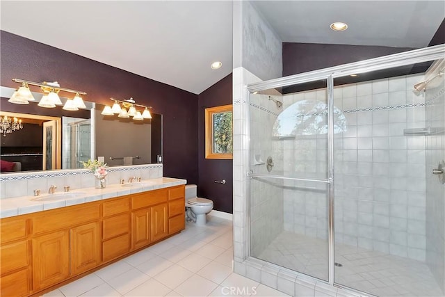 bathroom with lofted ceiling, vanity, toilet, and walk in shower