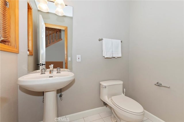 bathroom with tile patterned floors and toilet