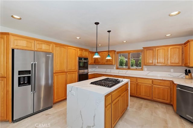 kitchen featuring pendant lighting, stainless steel appliances, a center island, and light stone countertops