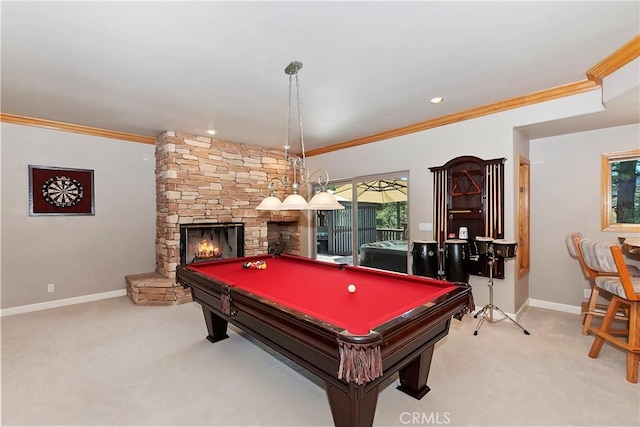 recreation room featuring ornamental molding, a stone fireplace, light carpet, and billiards