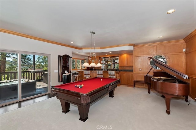 game room featuring bar, crown molding, light carpet, and billiards