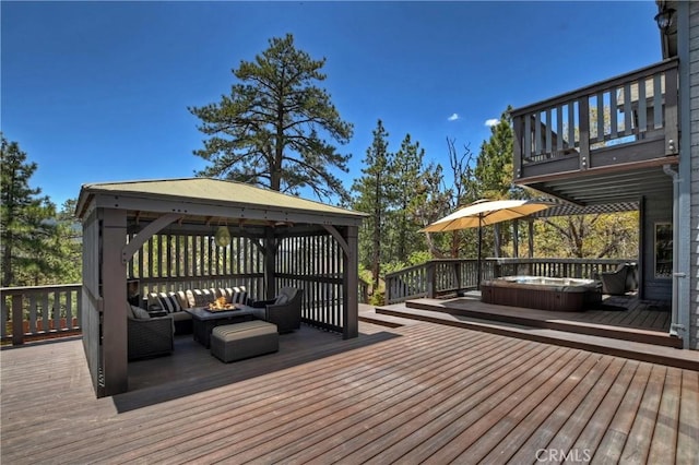 deck with a fire pit and a gazebo