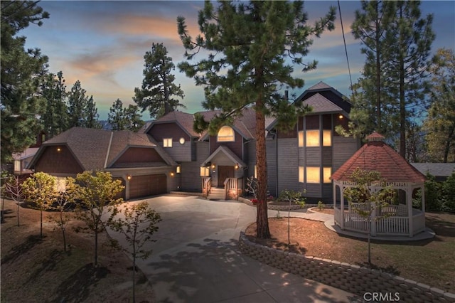 view of front of house with a garage and a gazebo