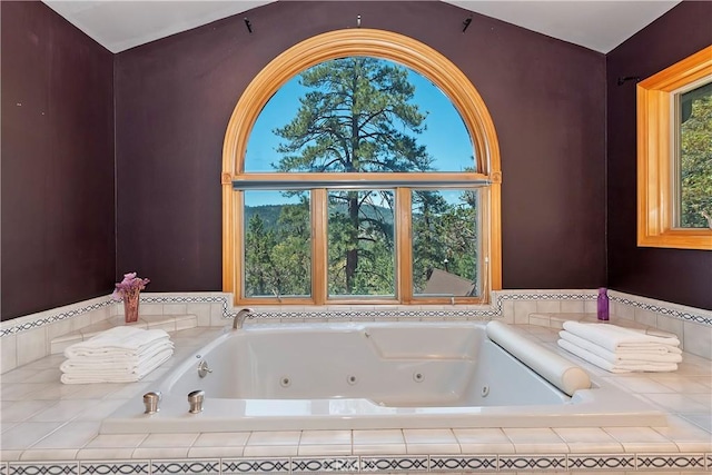 bathroom featuring tiled bath