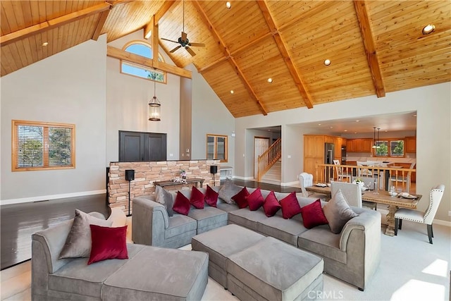 living room with high vaulted ceiling, beam ceiling, and wooden ceiling