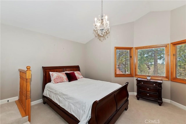 carpeted bedroom featuring lofted ceiling and an inviting chandelier