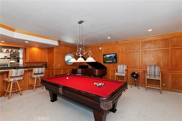 rec room featuring billiards, ornamental molding, light colored carpet, and indoor bar