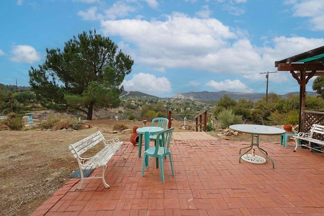 view of patio / terrace with a mountain view