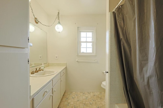 bathroom with vanity, walk in shower, and toilet