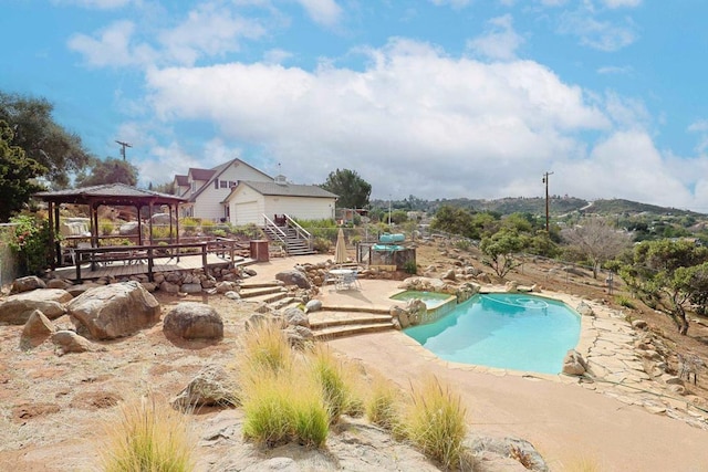 view of pool featuring a gazebo and a patio area