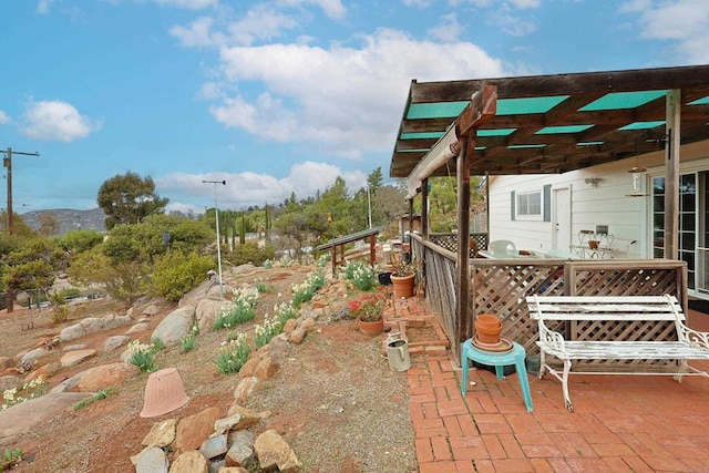 view of patio / terrace with a mountain view