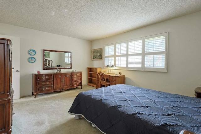 carpeted bedroom featuring a textured ceiling