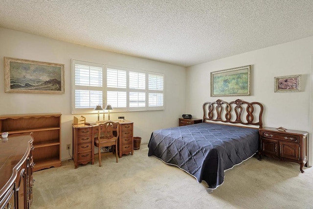 bedroom featuring light carpet and a textured ceiling