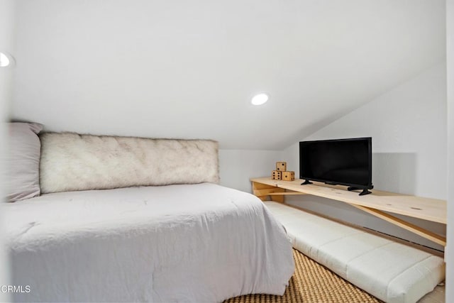 bedroom with lofted ceiling and recessed lighting