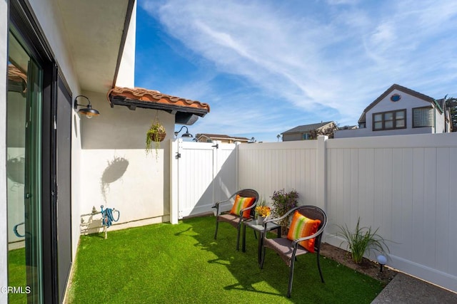 view of yard with a gate and fence