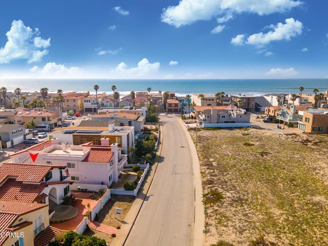 birds eye view of property featuring a water view and a residential view