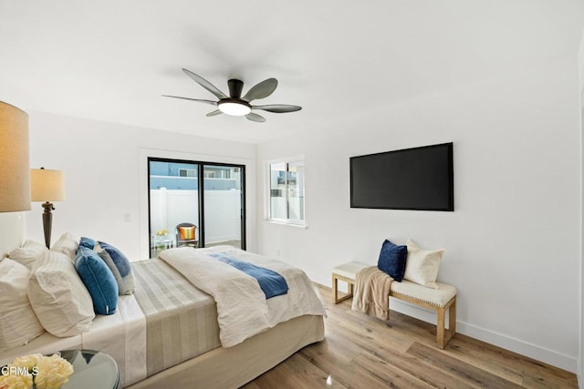 bedroom featuring access to outside, light wood-type flooring, a ceiling fan, and baseboards