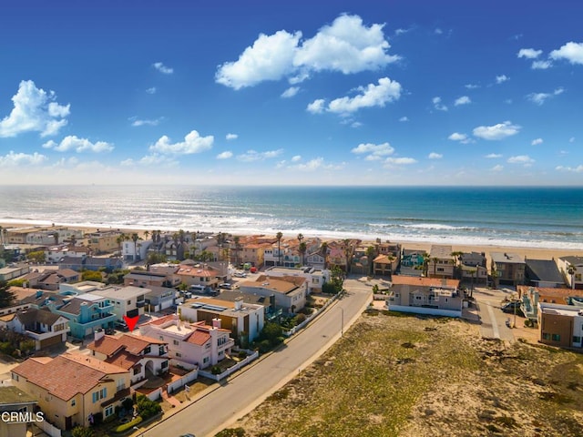 birds eye view of property with a water view, a residential view, and a view of the beach