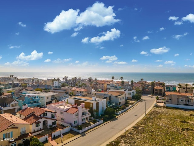 bird's eye view featuring a water view and a residential view