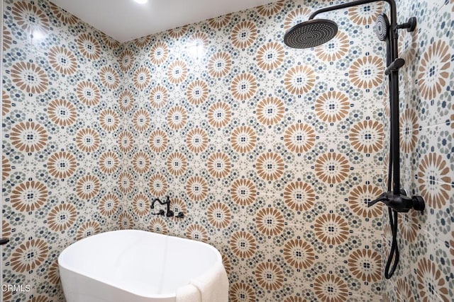 bathroom with a soaking tub, a tile shower, and tile walls