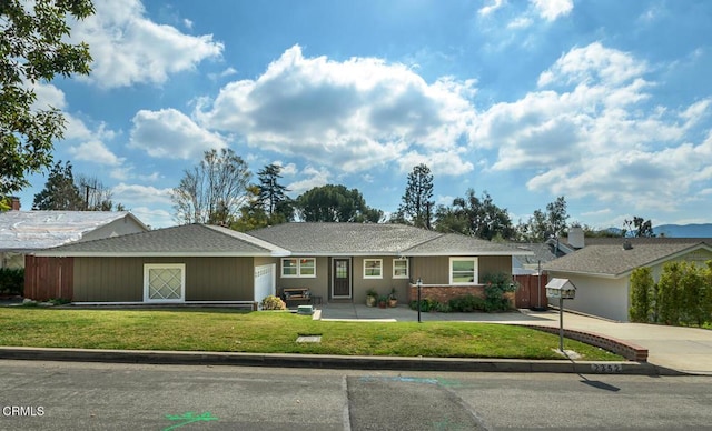 ranch-style house with a front lawn