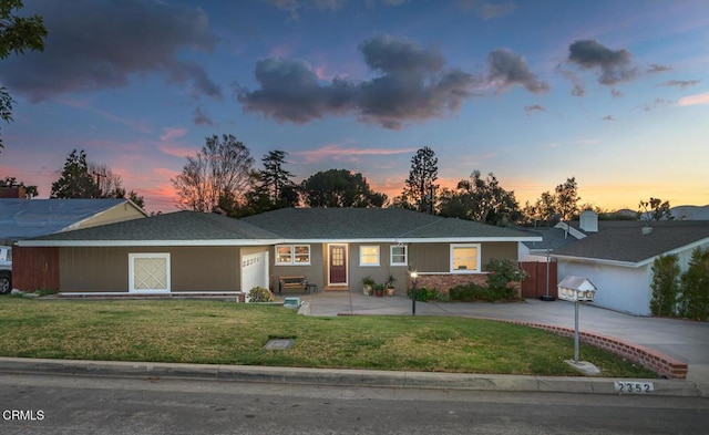 ranch-style house featuring a lawn