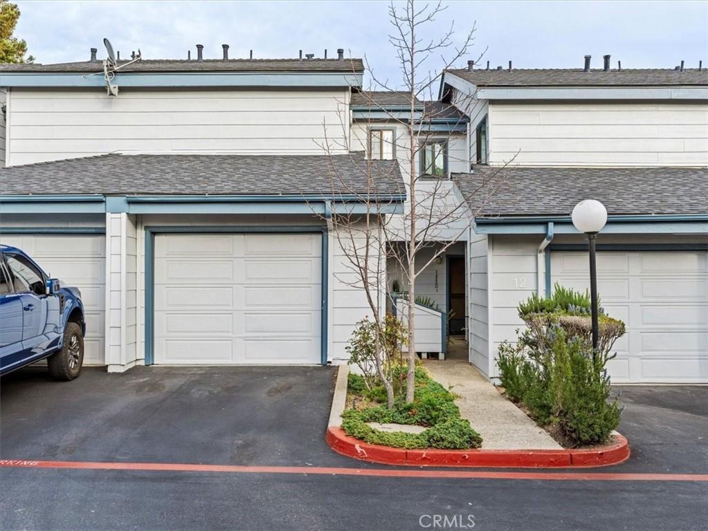2225 Exposition Dr Unit 11, San Luis Obispo, CA 93401 - multi unit property featuring roof with shingles and asphalt driveway