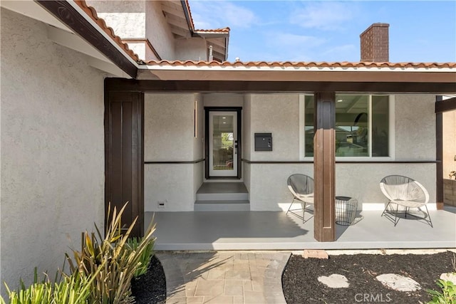 entrance to property with a patio area