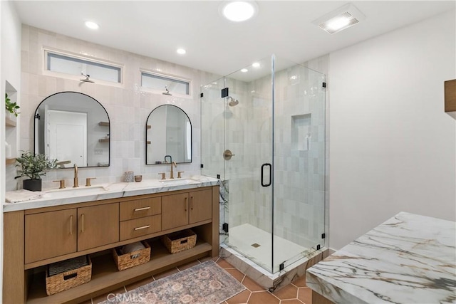 bathroom with tile patterned flooring, an enclosed shower, and vanity