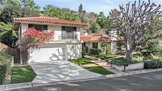 mediterranean / spanish-style home with a garage