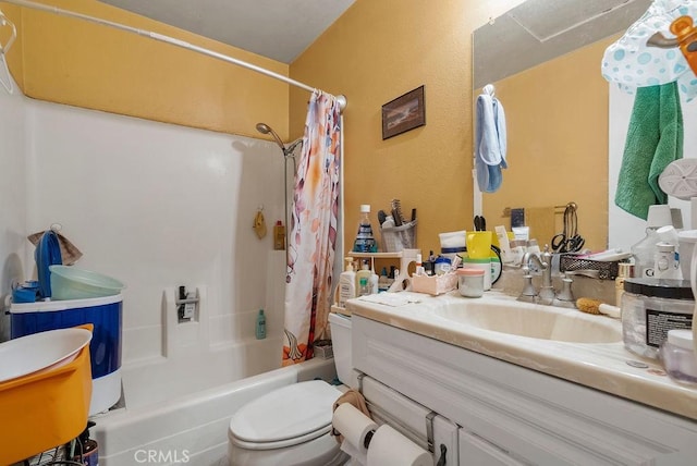 full bathroom featuring toilet, vanity, and shower / bathtub combination with curtain