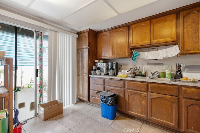 kitchen with sink and light tile patterned floors