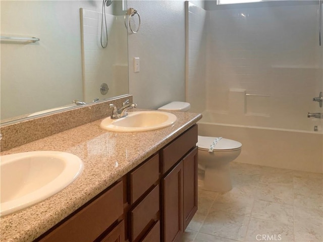 full bath with double vanity, a sink, toilet, and  shower combination