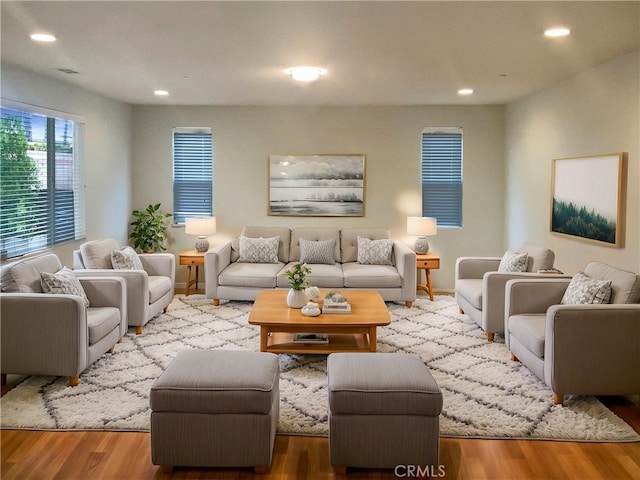 living room with recessed lighting and wood finished floors