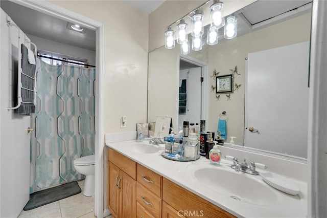 full bathroom featuring shower / tub combo with curtain, vanity, tile patterned floors, and toilet