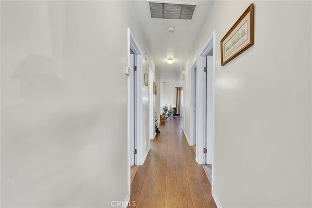 hallway with wood-type flooring