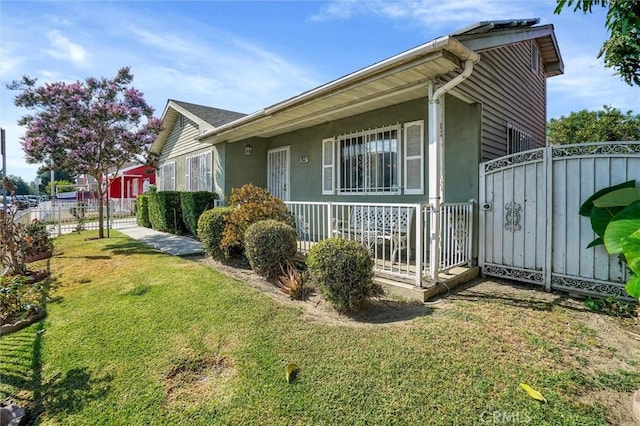 view of side of property with a yard