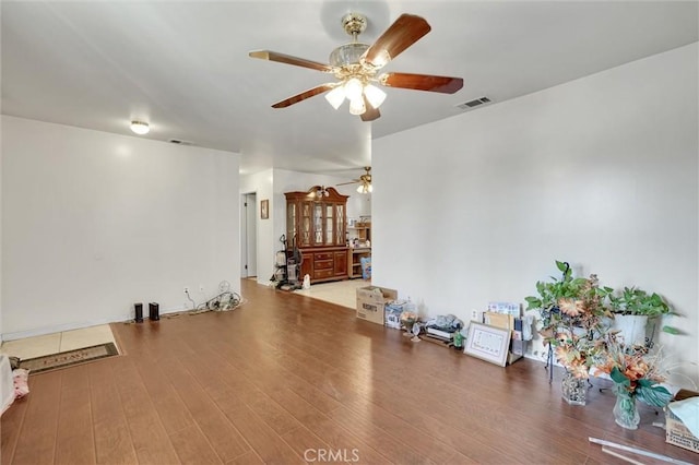 interior space with hardwood / wood-style floors and ceiling fan