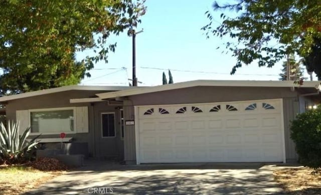 ranch-style house featuring a garage