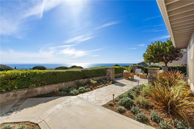 view of patio / terrace with a water view