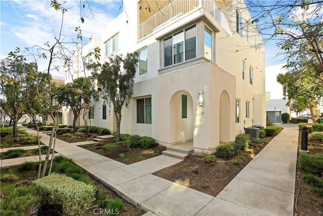 view of property with central AC unit