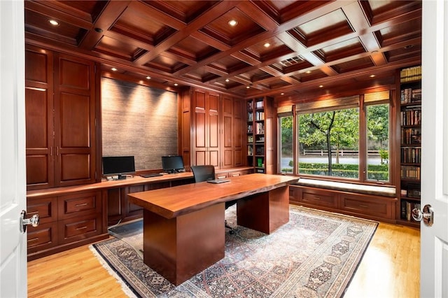 office area with light wood finished floors, beam ceiling, wooden ceiling, and coffered ceiling