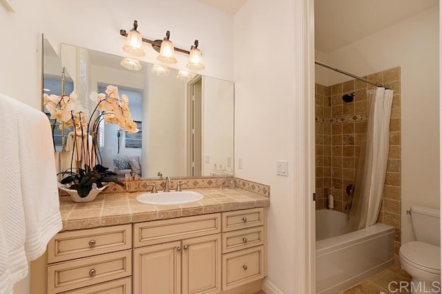 full bath featuring toilet, shower / bath combination with curtain, and vanity