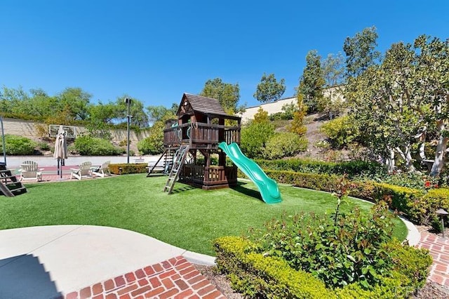 communal playground with a yard and a patio