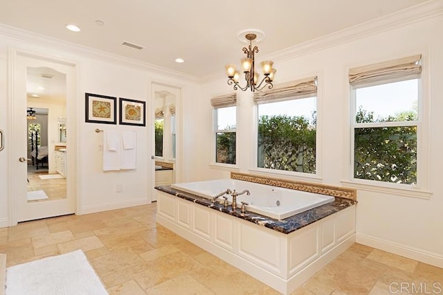 full bathroom with a chandelier, a garden tub, visible vents, baseboards, and crown molding