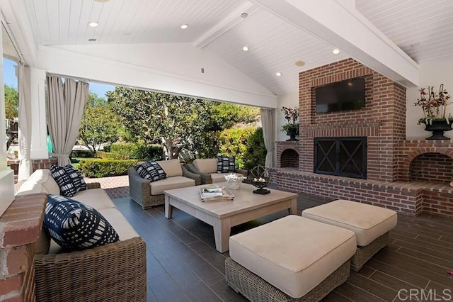 view of patio / terrace featuring an outdoor living space with a fireplace