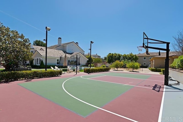 view of sport court featuring a residential view and community basketball court