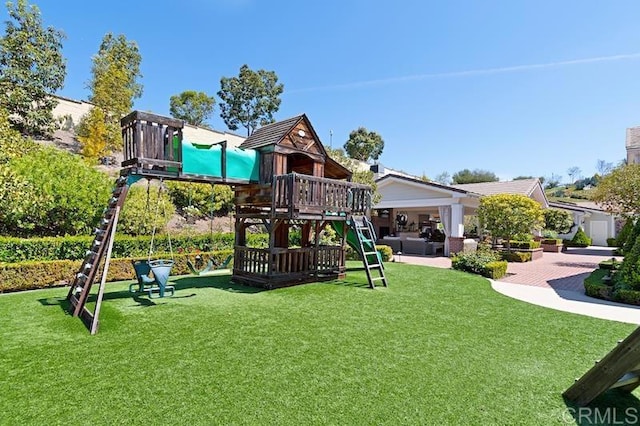 view of play area with an outdoor hangout area and a lawn