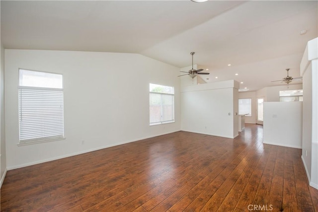 spare room with ceiling fan, lofted ceiling, and dark hardwood / wood-style floors